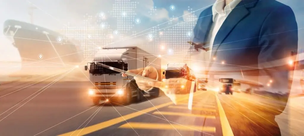 Freight trucks on a highway with digital logistics network overlay.